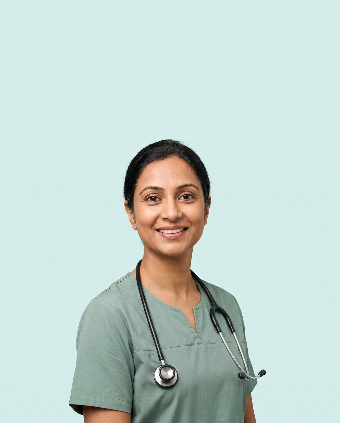 A clinician in a sage tunic with a stethoscope, listening with a warm smile